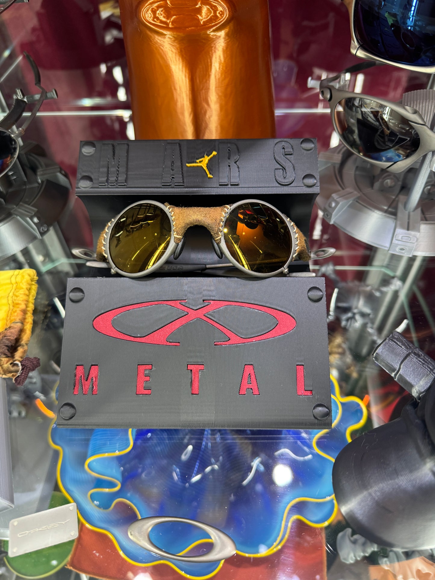 Oaklie Mars Display Stand with Red Leather X-Metal Logo Insert Jordan Logo